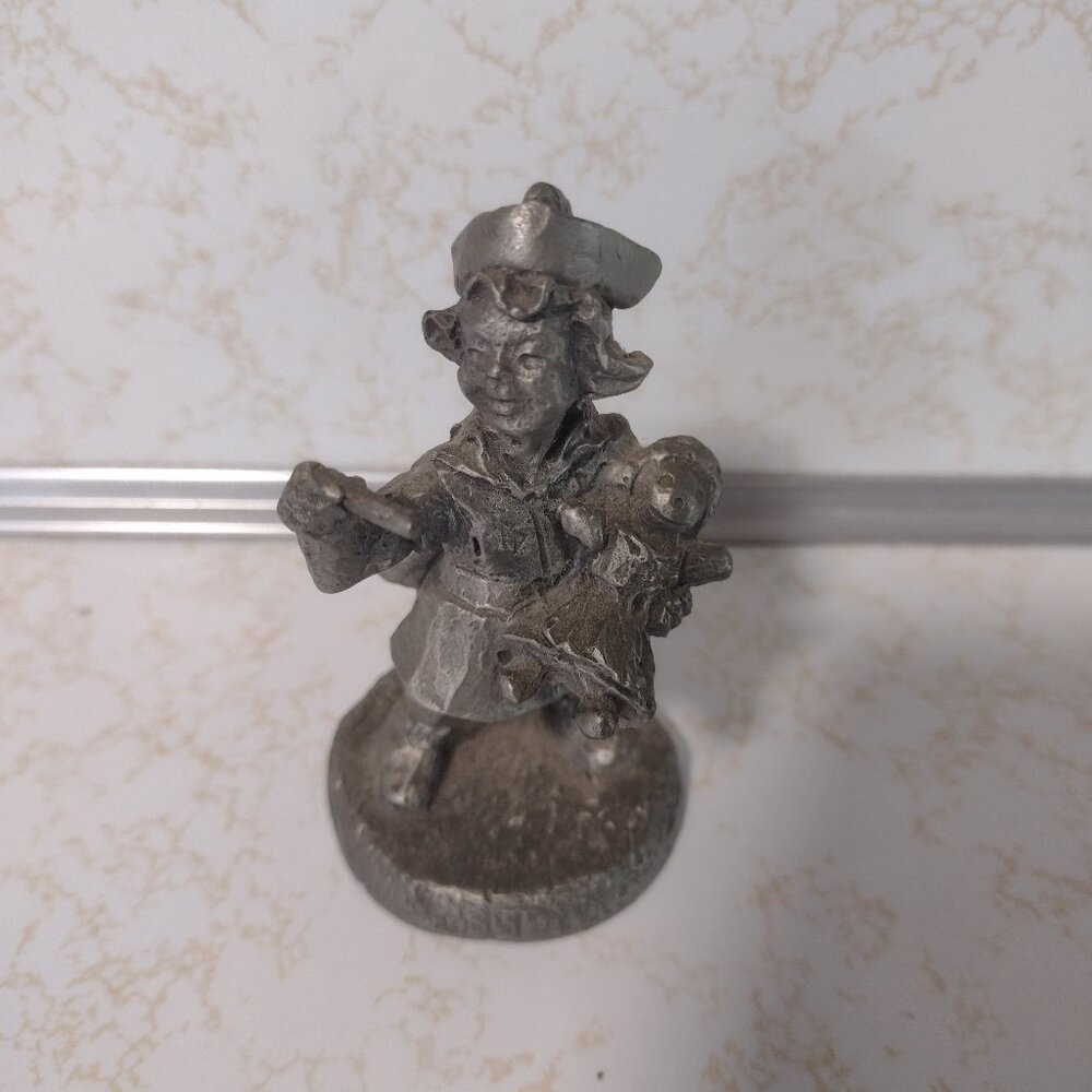 Solid pewter nurse with baby in her arms